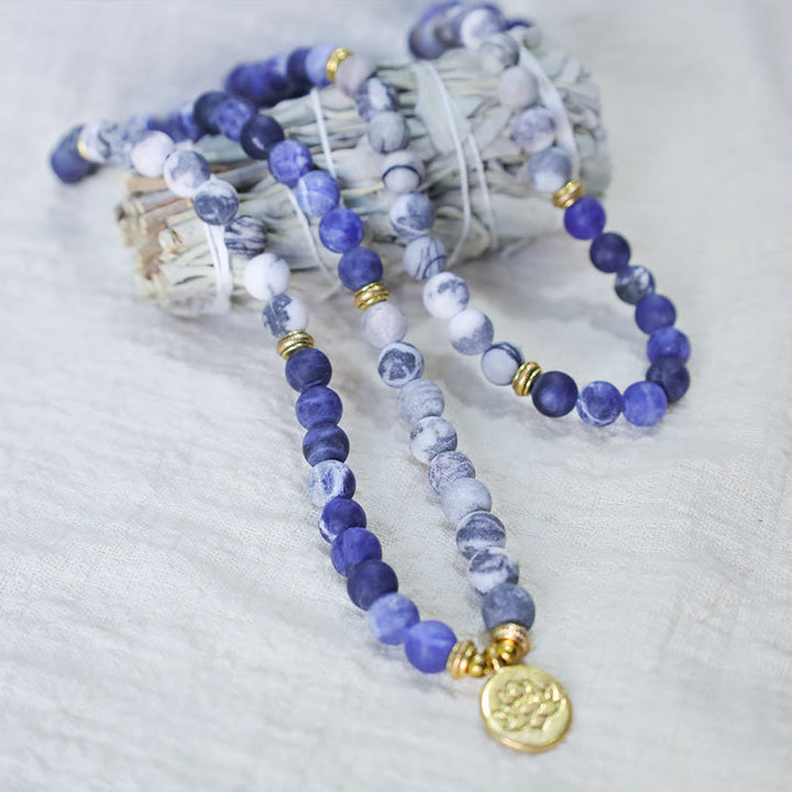 Bracelet Mala avec pendentif lotus en 108 perles de jaspe Picasso naturel et pierre bleue Buddha Stones