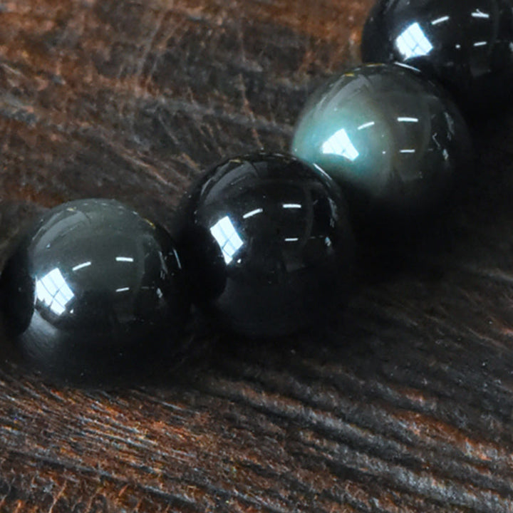 Bracelet de transformation positive en perles de cuivre et obsidienne arc-en Buddha Stones
