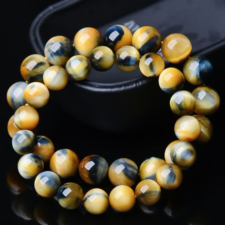 Bracelet de force, de courage et de protection en œil de tigre avec Buddha Stones
