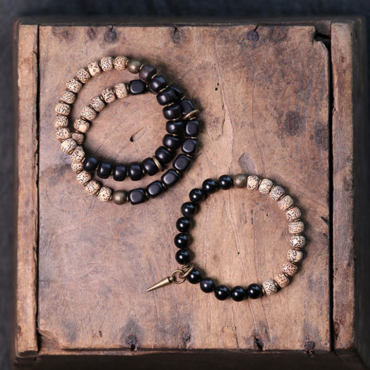 Bracelet de paix en cuivre et bois d'ébène avec Buddha Stones et graines de Bodhi tibétaines