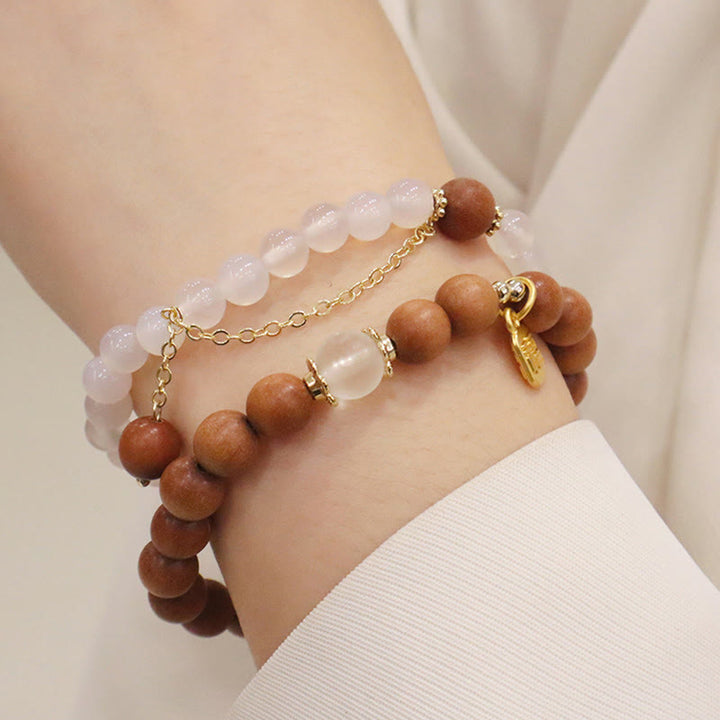 Bracelet de protection à breloques en bois de santal et œil de chat Fu avec Buddha Stones