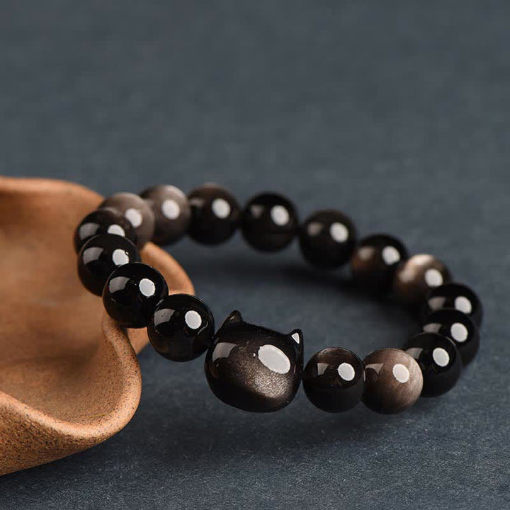 Bracelet de protection porte-bonheur en obsidienne dorée et argentée avec Buddha Stones et jolie patte de chat porte-bonheur - Obsidienne argentée - Tête de chat - 10 mm - image 25