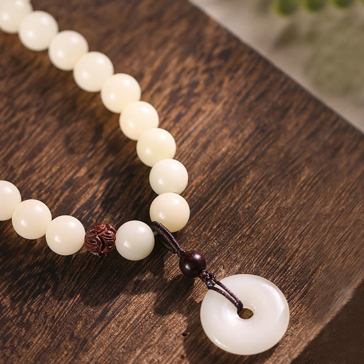 Bracelet double tour en harmonie avec boucle de paix en bois de santal vert et graines de Bodhi et Buddha Stones
