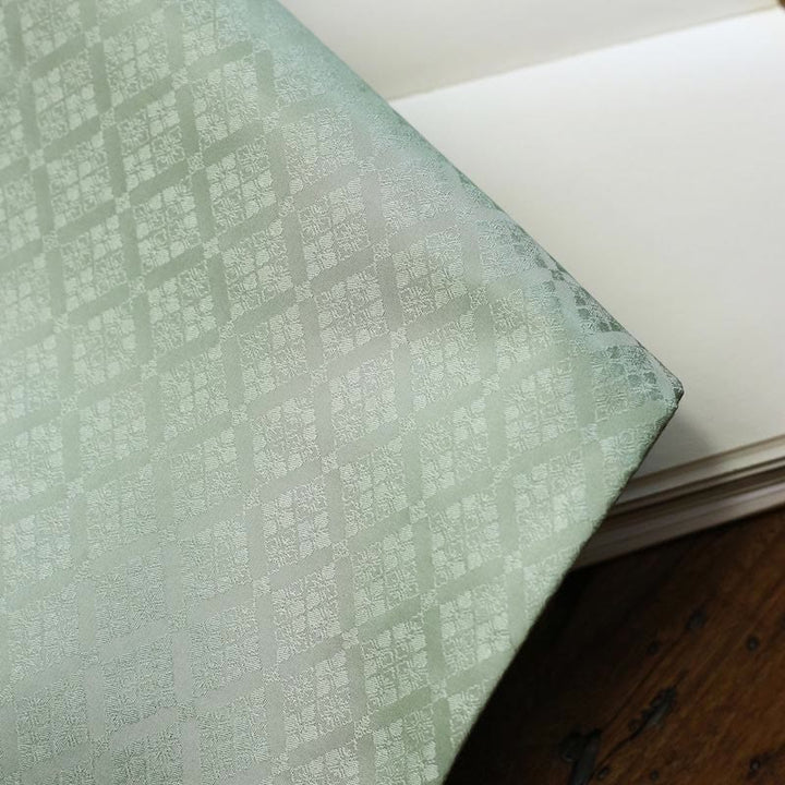 Dessous de verre élégant à motif de brocart floral pour tasse à thé