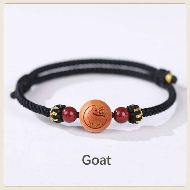 Bracelet de richesse en bois de pêche naturel Buddha Stones et caractère Fu du zodiaque chinois sculpté en cinabre