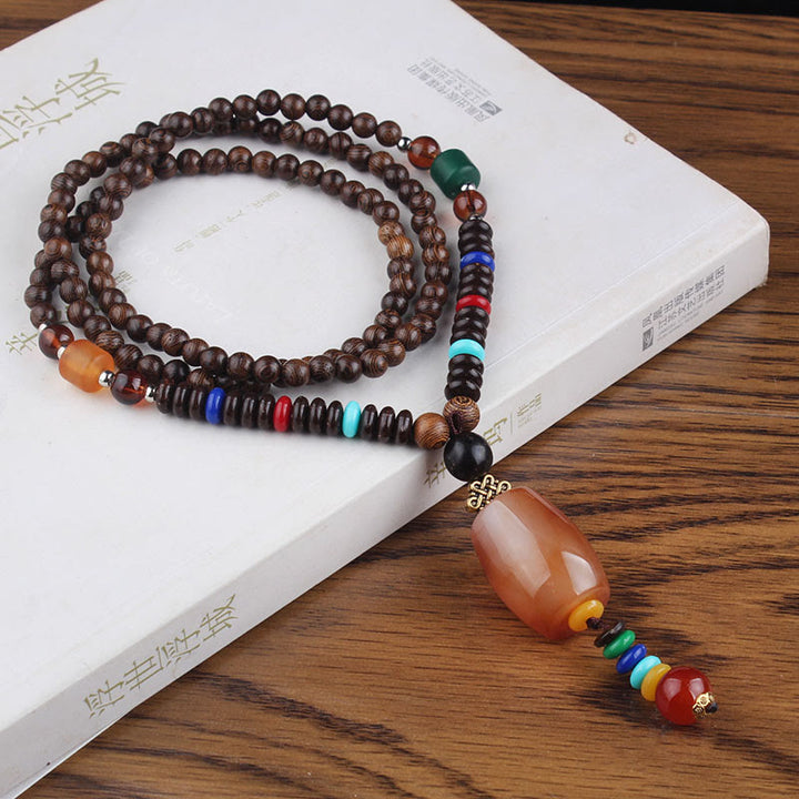 Collier pendentif en Buddha Stones tibétain en bois de wengé Bodhi Seed Agate Balance Peace
