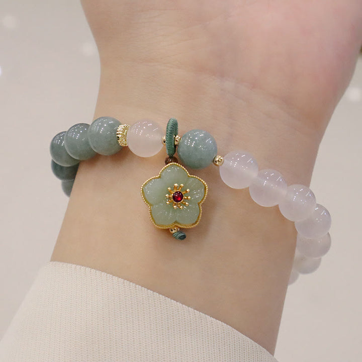 Bracelet de protection avec boucle de paix en Buddha Stones et jade blanc et fleur de lotus