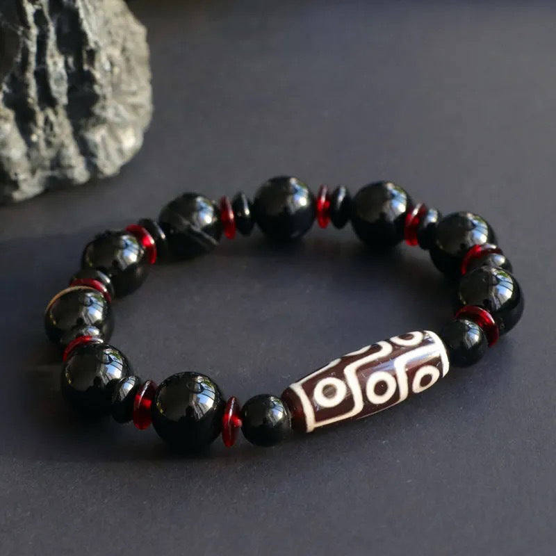 Bracelet de protection de richesse en perles dzi à neuf yeux en onyx noir de Buddha Stones