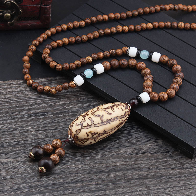 Collier pendentif en Buddha Stones tibétain en bois de wengé Bodhi Seed Agate Balance Peace