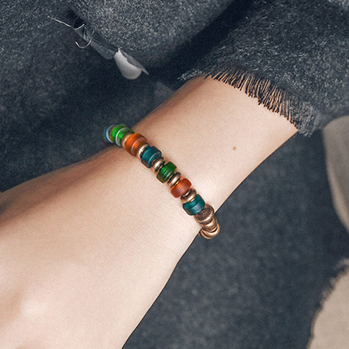 Bracelet tibétain en perles de verre colorées et en cuivre