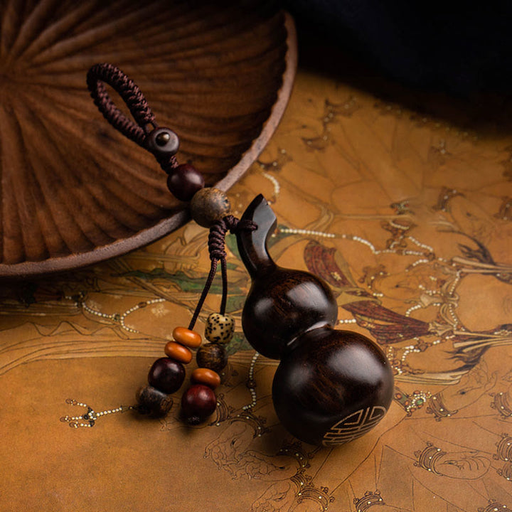 Porte-clés porte-bonheur en ébène tibétain à petites feuilles de gourde en bois de santal rouge