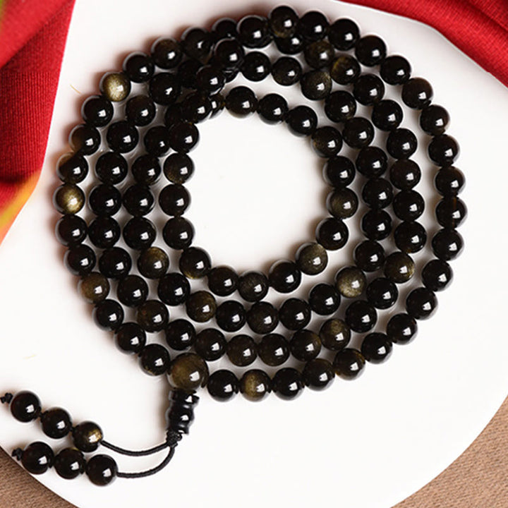 Bracelet de richesse en obsidienne naturelle dorée avec 108 perles de Mala Buddha Stones