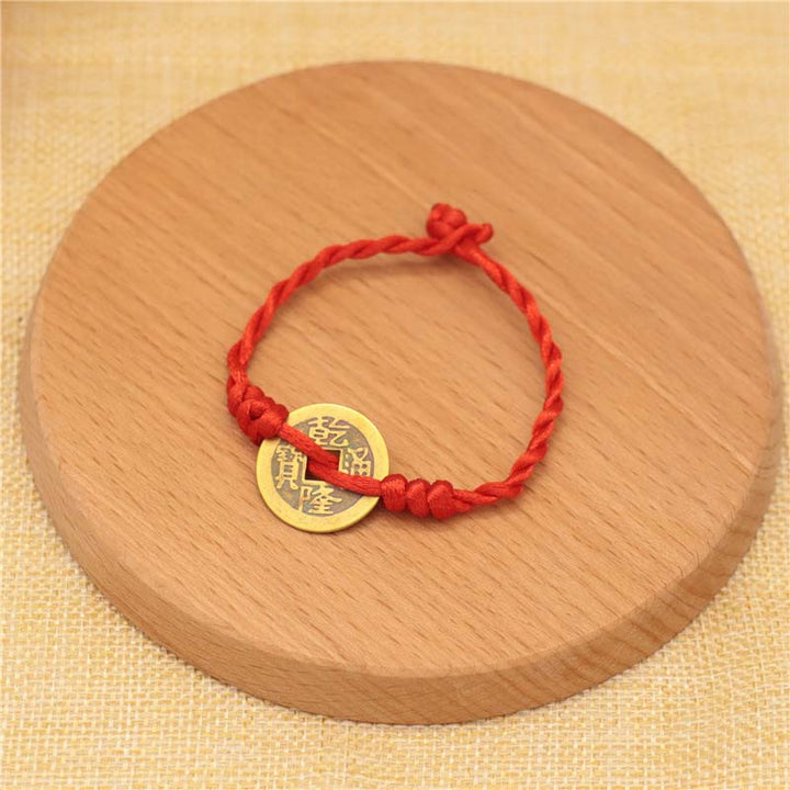 Bracelet tissé en fil rouge avec pièces de cuivre et Buddha Stones