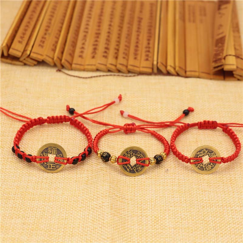 Bracelet tissé en fil rouge avec pièces de cuivre et Buddha Stones