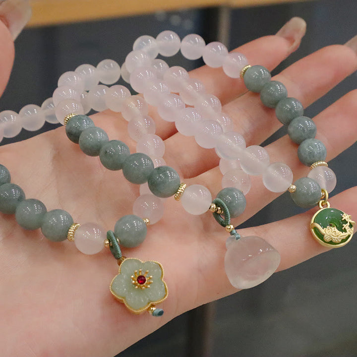 Bracelet de protection avec boucle de paix en Buddha Stones et jade blanc et fleur de lotus