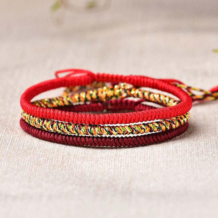 Bracelet tibétain porte-bonheur avec 3 Buddha Stones et cordon rouge