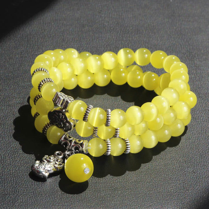 Bracelet triple tour de soutien PiXiu œil de chat en Buddha Stones