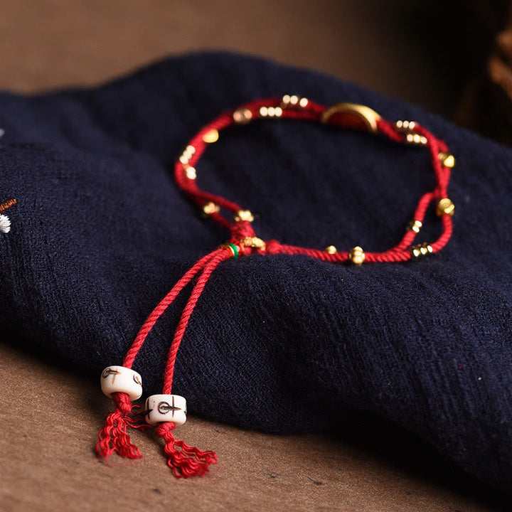 Bracelet en corde rouge tressée porte-bonheur en forme de boulettes de cinabre faites à la main par Buddha Stones