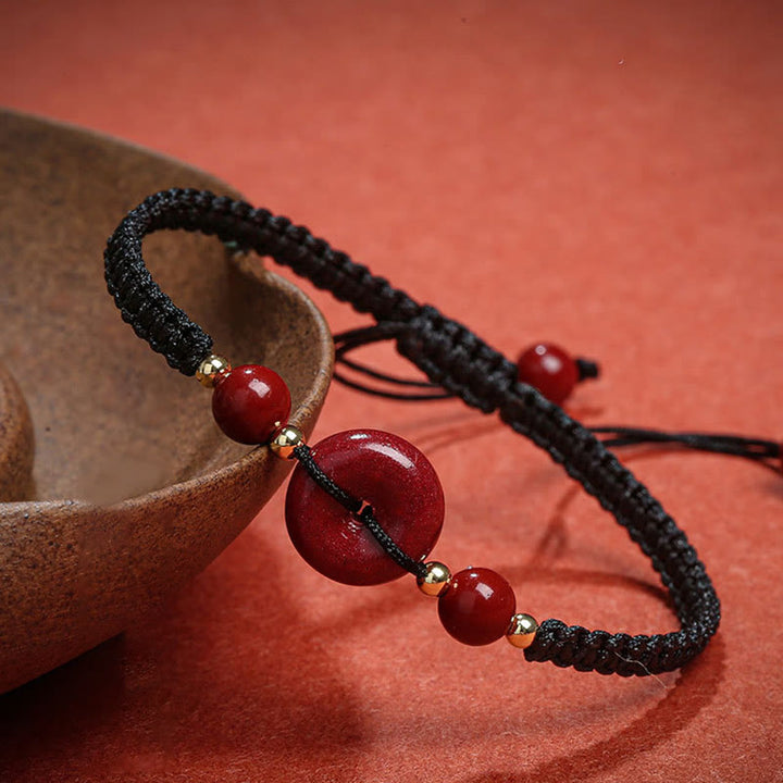 Bracelet de bénédiction en corde avec boucle de paix en cinabre naturel et Buddha Stones