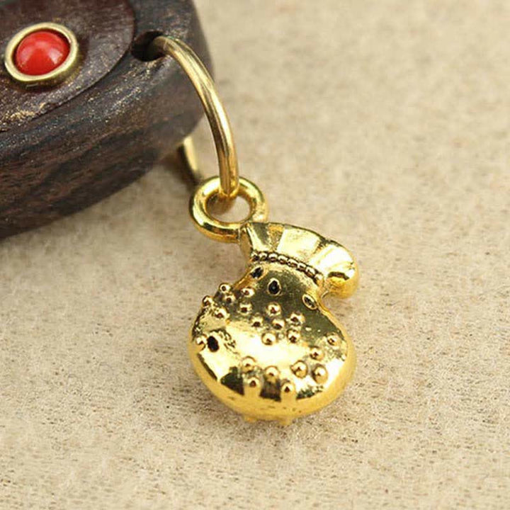 Collier pendentif Thangka en ébène du Tibet représentant les cinq dieux de la richesse
