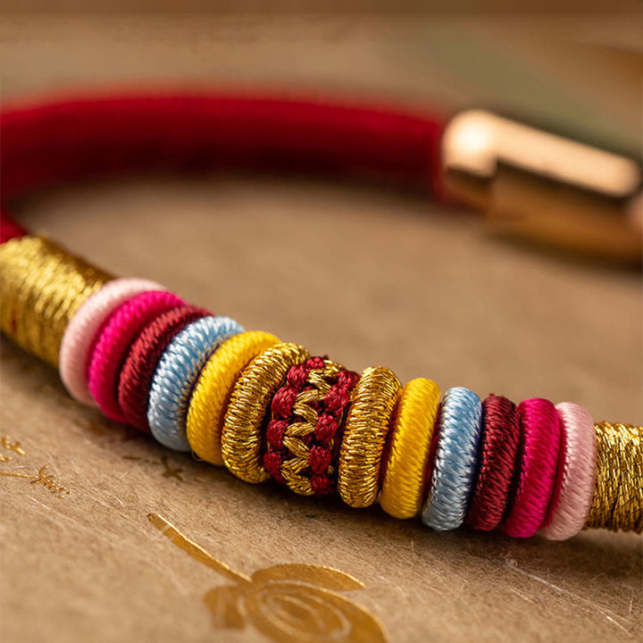 Bracelet tressé à boucle magnétique en Buddha Stones tibétaines fait à la main avec protection des nœuds King Kong