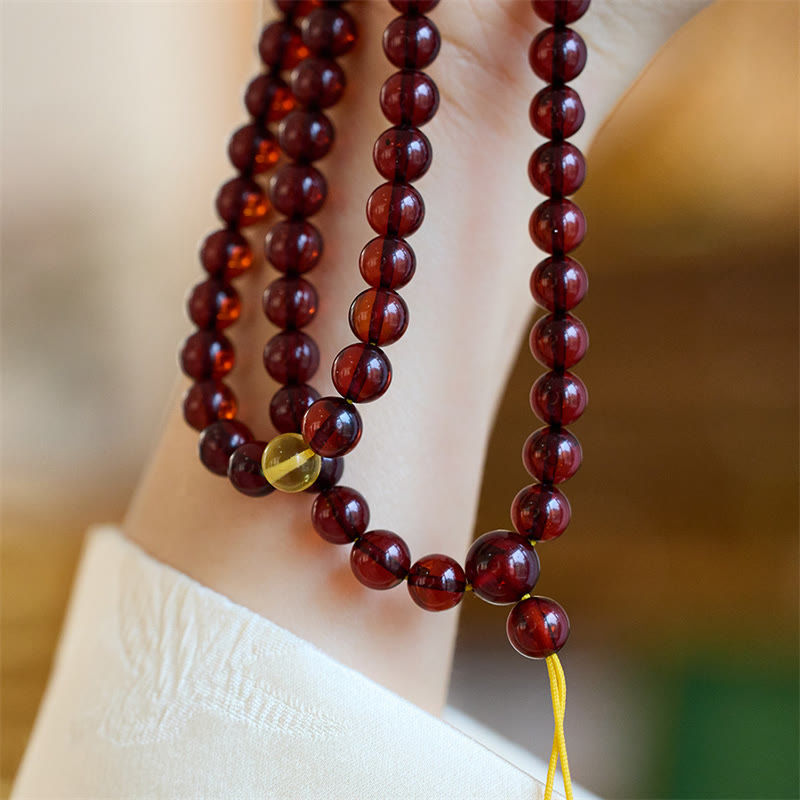 Bracelet Mala en Buddha Stones avec 108 perles d'ambre transparentes contre l'anxiété
