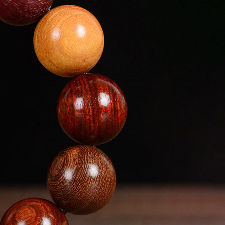 Bracelet de guérison et de protection en bois de santal multicolore Buddha Stones