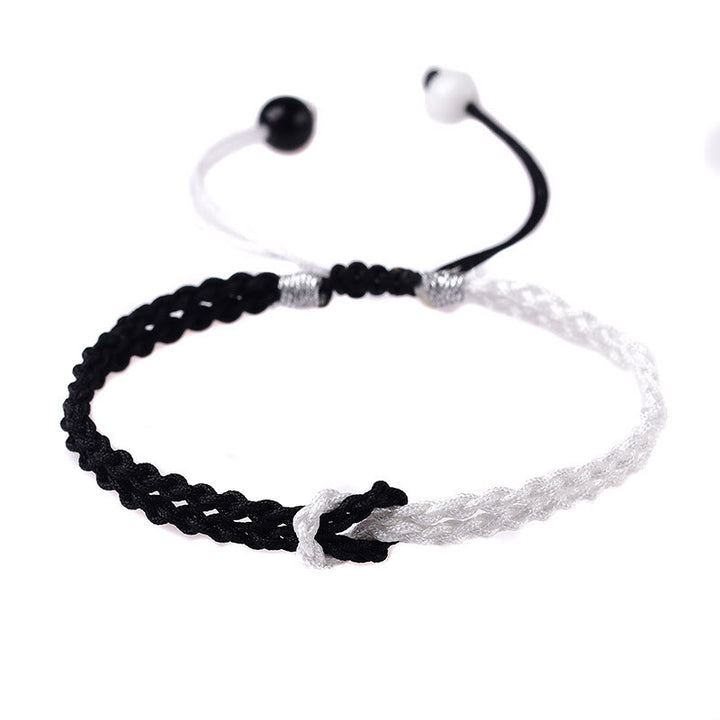 Bracelet de guérison tressé en corde noire et blanche fait main avec Buddha Stones
