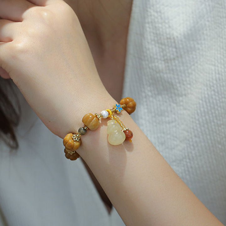 Bracelet de richesse Pixiu en jade et soie dorée avec Buddha Stones