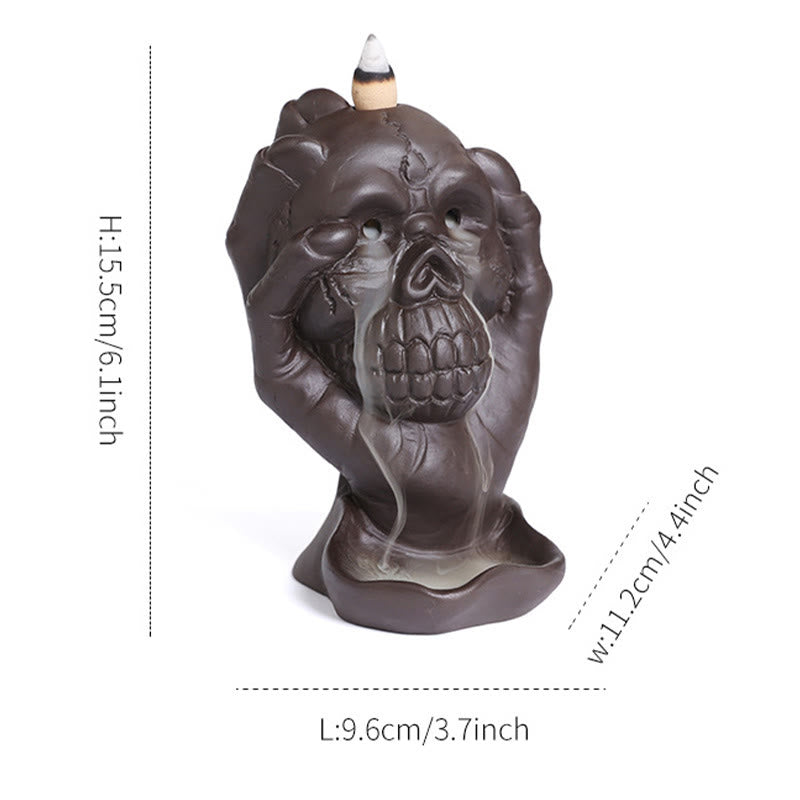 Brûleur d'encens spirituel en argile violette avec tête de mort et main fantôme en Buddha Stones