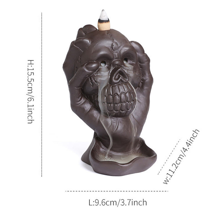 Brûleur d'encens spirituel en argile violette avec tête de mort et main fantôme en Buddha Stones