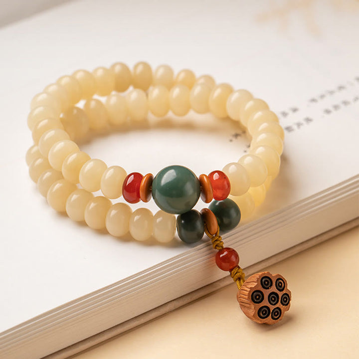 Bracelet double tour avec breloque en forme de gousse de lotus et graines de Bodhi et Buddha Stones
