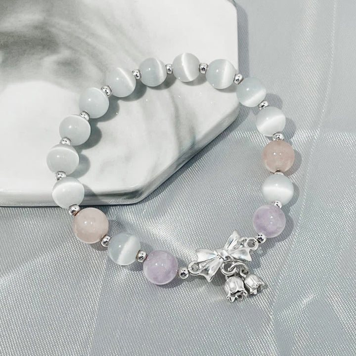 Bracelet à breloques en forme de rosette avec œil de chat, lavande et améthyste de Buddha Stones