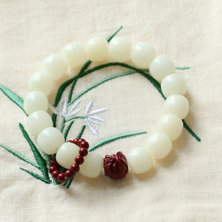 Buddha Stones de Bodhi Naturelles Cinabre Lion Dansant Charme Sagesse Harmonie Poignet Mala