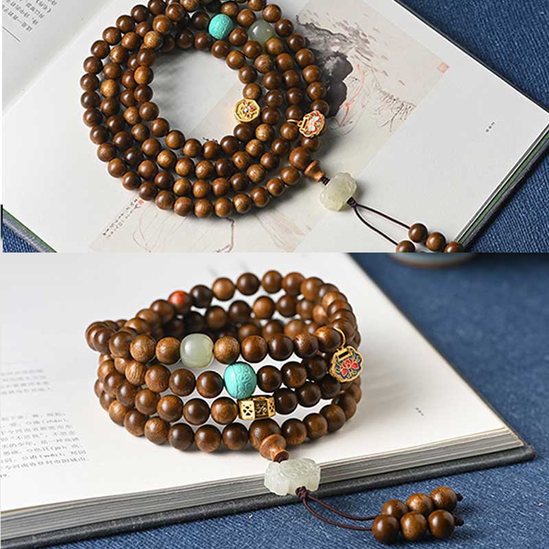 Bracelet Mala tibétain de protection et de calme en bois de rose avec Buddha Stones