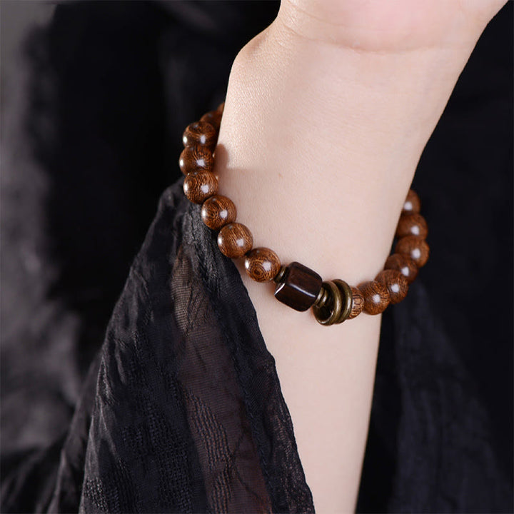 Bracelet de spiritualité en bois de Phoebe Zhennan Buddha Stones
