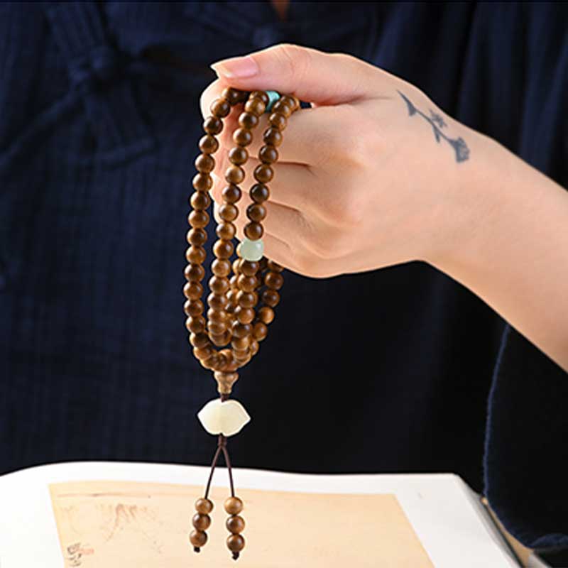 Bracelet Mala tibétain de protection et de calme en bois de rose avec Buddha Stones
