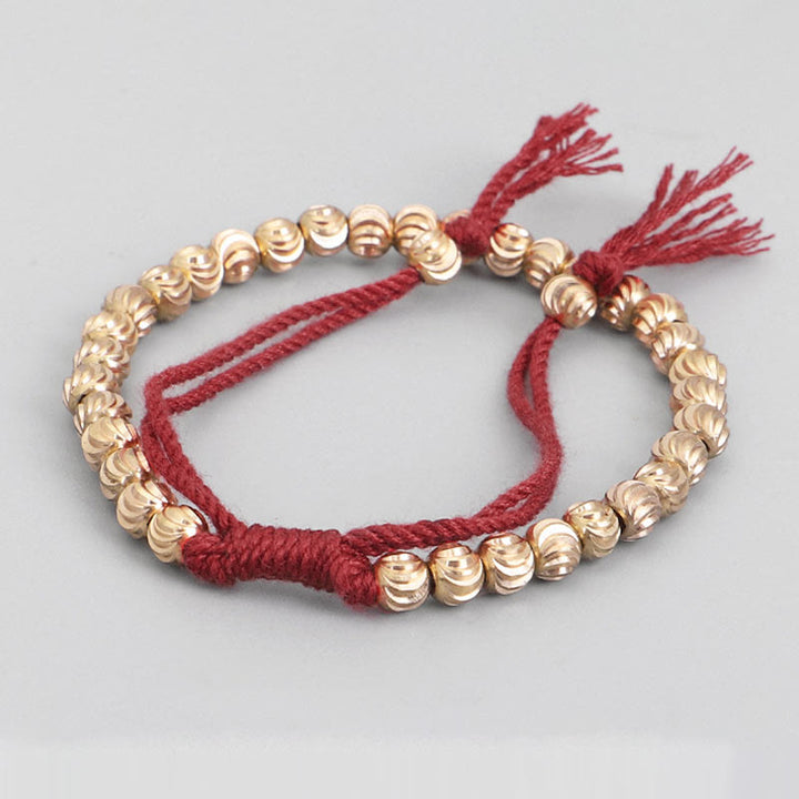 Bracelet porte-bonheur en perles de cuivre tibétaines faites à la main avec Buddha Stones