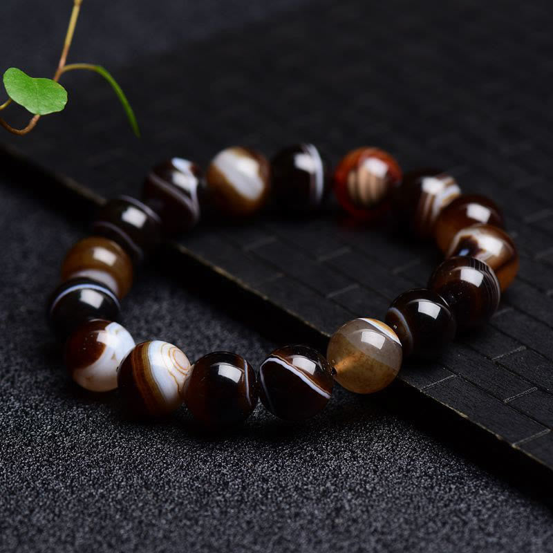 Bracelet de bonheur positif tibétain en sardonyx Buddha Stones