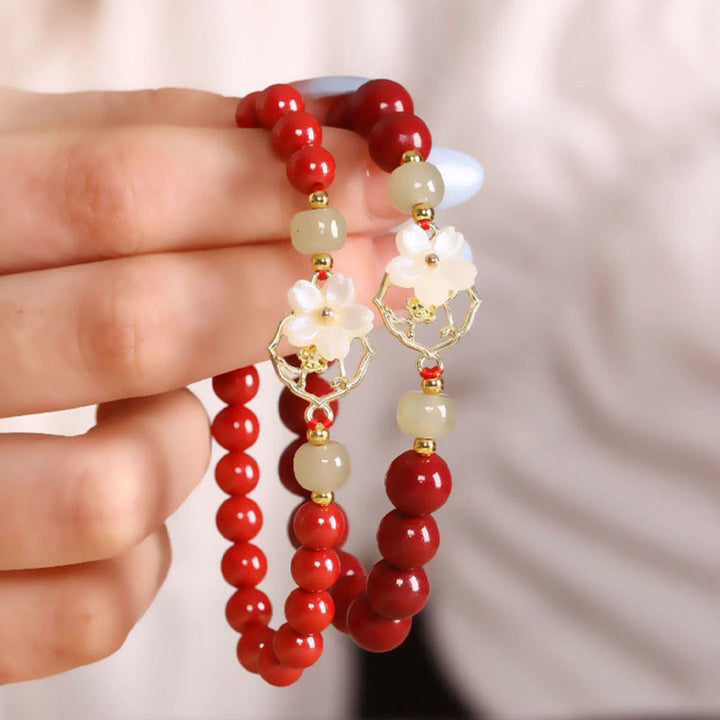 Bracelet de bénédiction en pierre de cinabre naturelle et jade Tridacna avec Buddha Stones