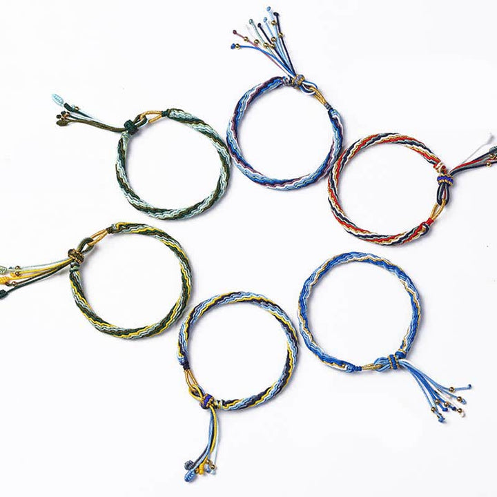 Bracelet tressé de protection avec cordon porte-bonheur et nœud de réincarnation