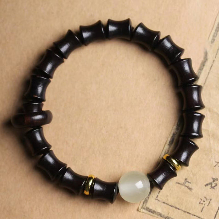 Bracelet de paix en bambou et bois de santal vert et ébène avec Buddha Stones