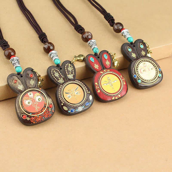 Collier pendentif Thangka en ébène du Tibet représentant les cinq dieux de la richesse