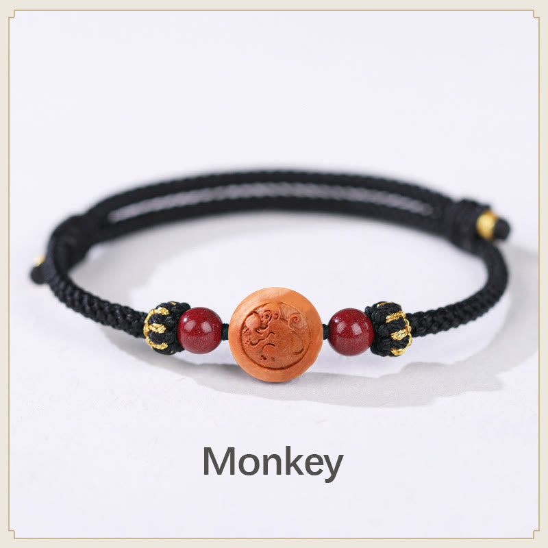 Bracelet de richesse en bois de pêche naturel Buddha Stones et caractère Fu du zodiaque chinois sculpté en cinabre