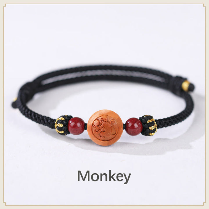 Bracelet de richesse en bois de pêche naturel Buddha Stones et caractère Fu du zodiaque chinois sculpté en cinabre