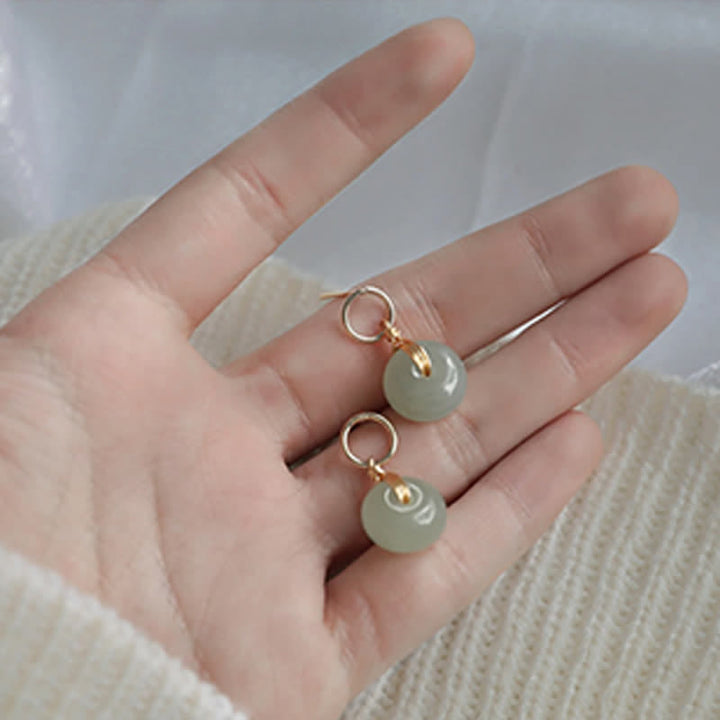 Boucles d'oreilles pendantes en jade avec Buddha Stones rondes et boucle de paix