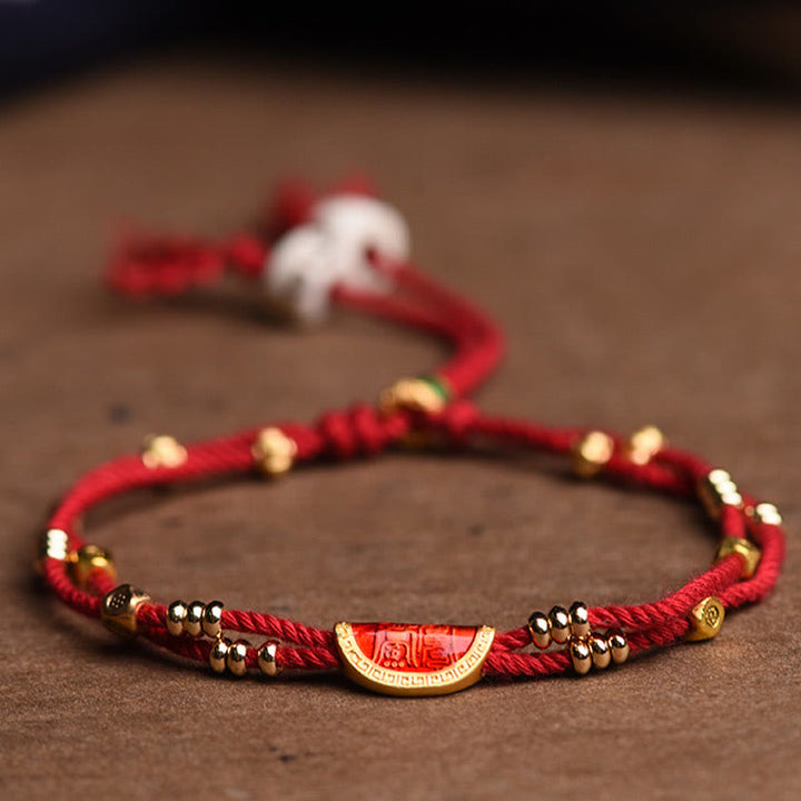 Bracelet en corde rouge tressée porte-bonheur en forme de boulettes de cinabre faites à la main par Buddha Stones