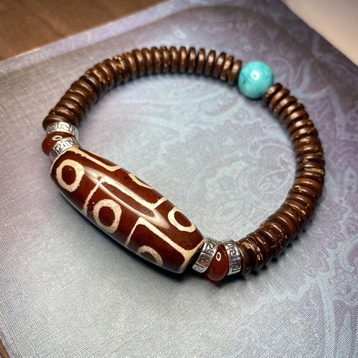 Bracelet de richesse en perles tibétaines à neuf yeux Dzi Buddha Stones