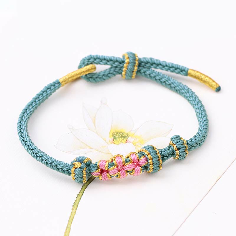 Bracelet tressé fait main à huit brins avec trois fleurs de pêcher et Buddha Stones