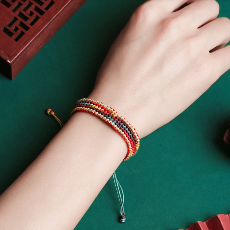 Bracelet tressé de protection multicolore arc-en-ciel fait main en Buddha Stones tibétaines